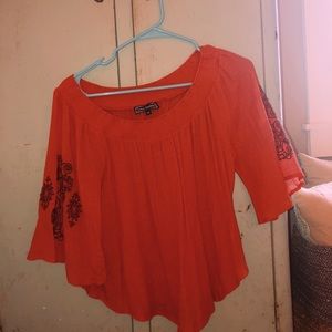 red off the shoulder top with arm details